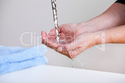 Water running into the hands