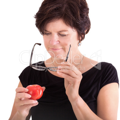 Woman checking tomato