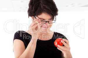 Woman checking tomato