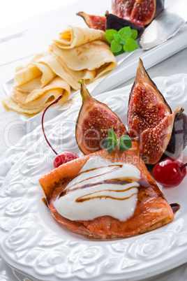 flambe pancakes with figs and cherries.