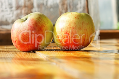 Two ripe apples on the table