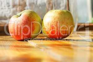 Two ripe apples on the table