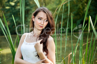 Portrait of a woman with long hair in park