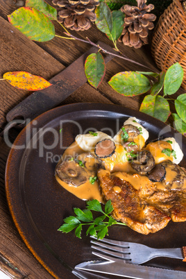 Steak with potato dumplings and forest mushroom sauce