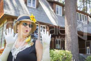 Attractive Woman in Twenties Outfit Near Antique House