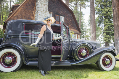 Attractive Woman in Twenties Outfit Near Antique Automobile
