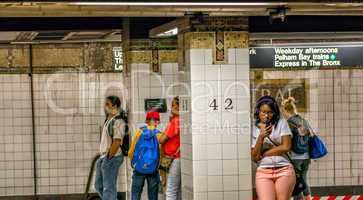 NEW YORK CITY - JUNE 15, 2013: Passengers await subway train on