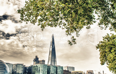 London, UK. City skyline along Thames river