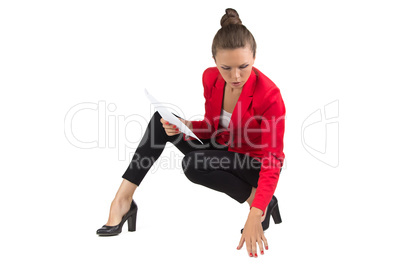 Businesswoman reading on floor