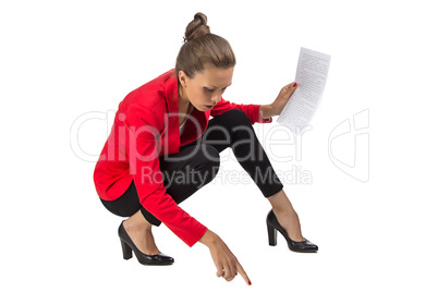 Portrait of businesswoman sitting on floor