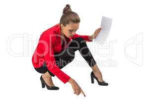 Portrait of businesswoman sitting on floor