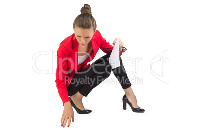 Businesswoman looking for something on floor