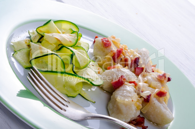 Silesian dumplings with Bacon and zucchini