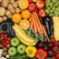 Obst, Früchte und Gemüse wie Orangen, Tomaten und Apfel Hinter