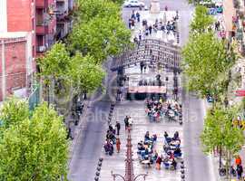 BARCELONA, SPAIN - MAY 21, 2005: Tourists enjoy city life on a b
