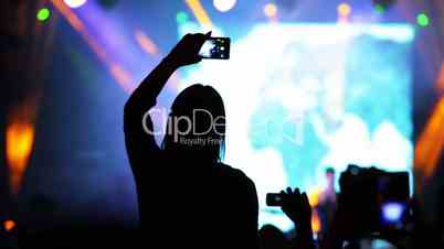 Girl with a Smartphone at a Rock Concert