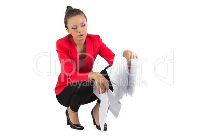 Businesswoman looking in sheets