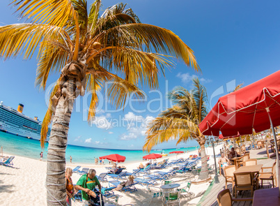 Caribbean Island Beach. Colourful umbrellas with clear water and