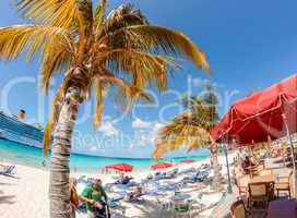 Caribbean Island Beach. Colourful umbrellas with clear water and