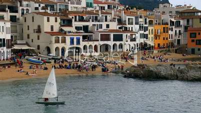 Optimist Dinghy Sailing in a Mediterranean Village