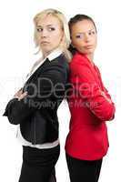Two businesswoman standing back-to-back