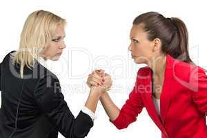 Arm wrestling of two businesswoman