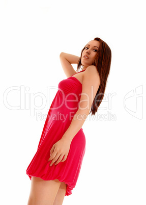 Girl standing in red dress.