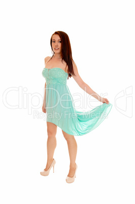 Woman holding her dress.