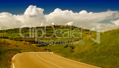 Road through Tuscany meadows and hills - Italy