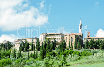 Medieval town of Tuscany over a hill in spring