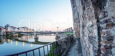 Walls of Pisa along Arno river