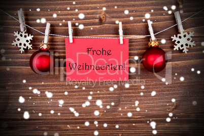 Frohe Weihnachten on a Red Banner in the Snow