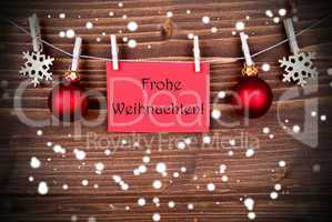 Frohe Weihnachten on a Red Banner in the Snow