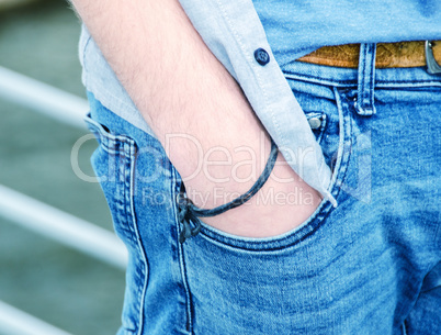 Boy with hand in jeans pocket