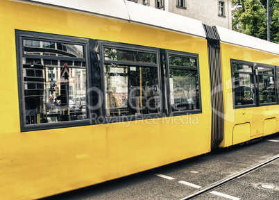 BERLIN - MAY 23, 2012: Yellow tram on city streets. The tram in