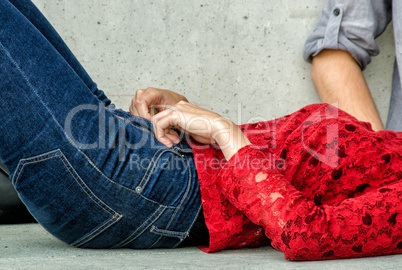 Couple relaxing on a city bench