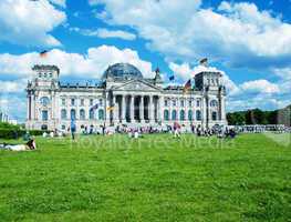BERLIN - MAY 27, 2012: Tourists walk along Reichstag area. More