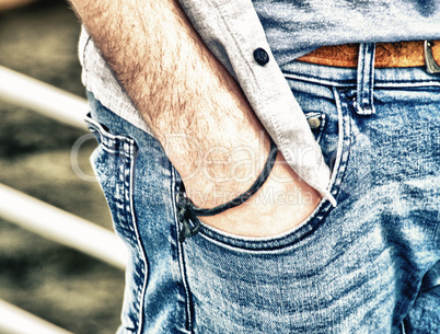 Boy with hand in jeans pocket