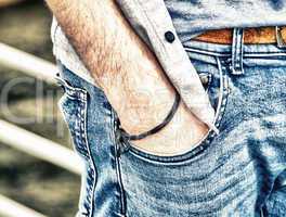 Boy with hand in jeans pocket