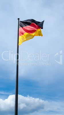 German flag against blue sky