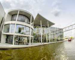 BERLIN - MAY 27, 2012: Tourists visit the modern buildings in Bu