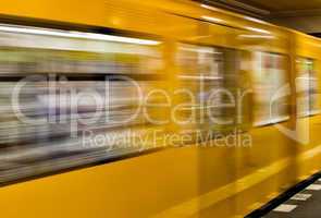 BERLIN - MAY 24, 2012: U-bahn train speeds up in subway station.