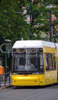 BERLIN - MAY 23, 2012: Yellow tram on city streets. The tram in