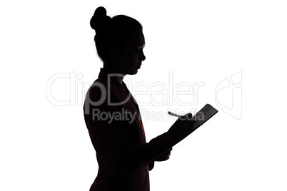 Businesswoman writing something