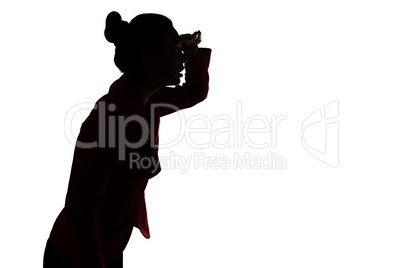 Silhouette of leaned forward woman