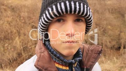 Sad child with winter cap