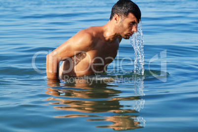 man coming out of the water