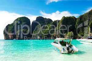 Motor boats on turquoise water in Maya Bay lagoon