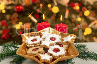 biscuits and candles under christmas tree