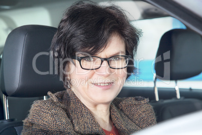 Woman sitting in car